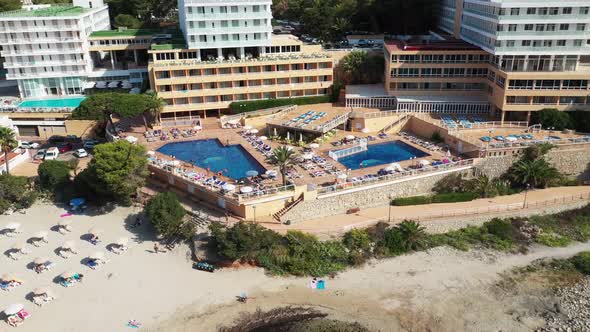 Aerial footage of the Spanish island of Ibiza showing the beautiful beach front and hotels