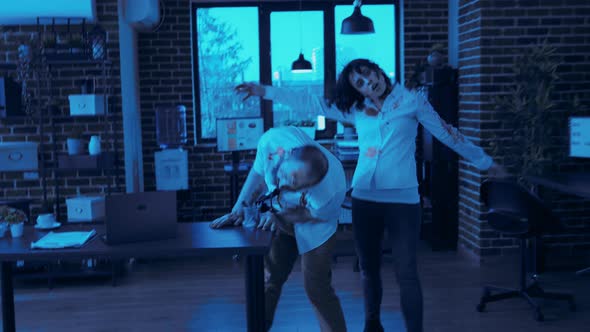 Dangerous Office Zombies Running Towards Camera in Workspace at Night