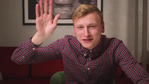 Smiling Young Man Waving and Looking at Camera Talking Make Live Video Conference Call Online Chat