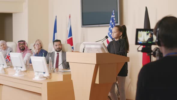 Little Female Eco Activist Making Speech at Conference