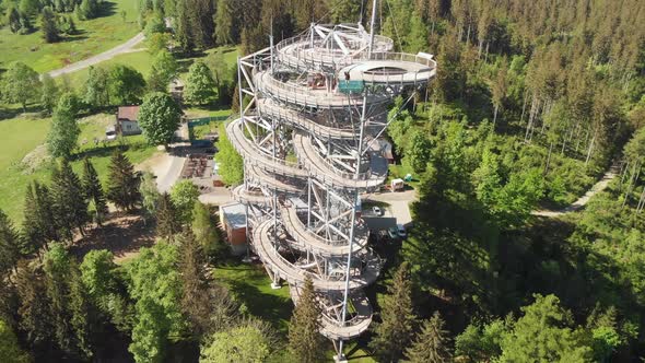 Aerial shot of an observation tower - sky walk over the clouds in Sudety mountains