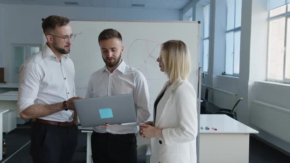 Bearded Man Chat with His Coworker About Online Work