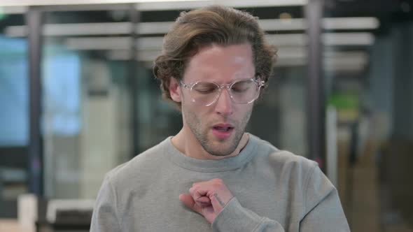 Portrait of Sick Young Businessman Coughing