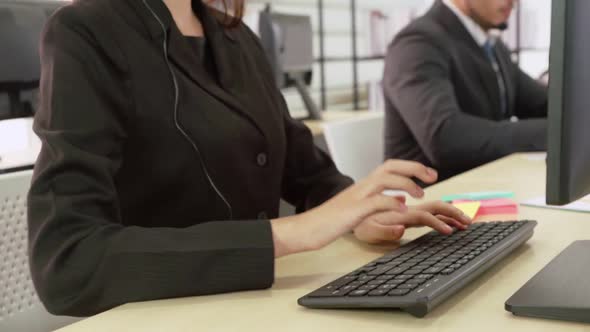 Business People Wearing Headset Working in Office