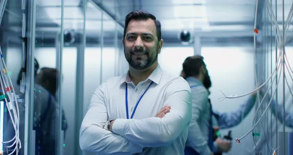 Male Manager Smiling in a Data Center