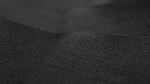 Black wave texture of fabric elastic bands close-up
