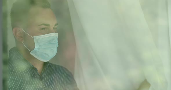 Young Man is Wearing Mask inside the Building