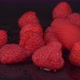 Fresh Raspberries Being Dropped Over Black Background In Slow Motion. - VideoHive Item for Sale