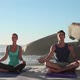 Young couple doing yoga on beach - VideoHive Item for Sale