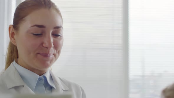 Cheerful Optometrist Conducting Eye Exam