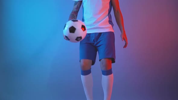 Front View of Freestyle Soccer or Futsal Player Juggling Ball with His Legs