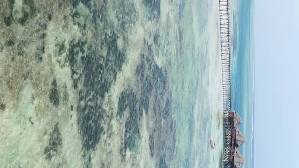 Vertical Video of the Ocean Near the Coast of Zanzibar Tanzania Aerial View