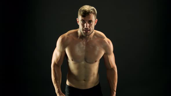 Man with Muscular Body Is Training