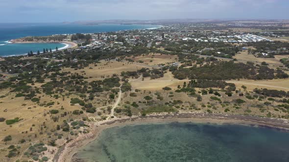 Aerial footage flying towards the town of Port Elliott in regional South Australia