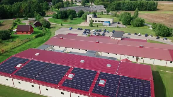 Rooftop and yard with solar panels at small factory (approx. 700 panels with 250 kW power)