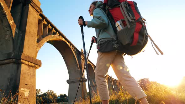 Female Sports Tourist Is Coming To an Abandoned Bridge