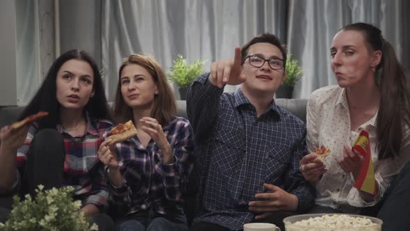 Four Friends Sitting on Couch Together and Watching Tv