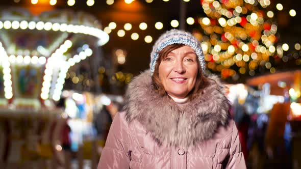 Happy Senior Woman Smiling at Christmas Market 20