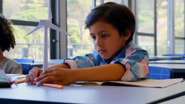 Schoolkids studying at desk in the classroom at school 4k