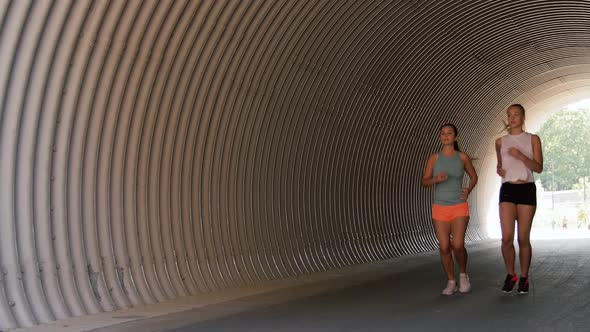 Young Women or Female Friends Running Outdoors