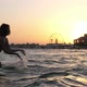 Happy Brunette Girl in Bikini Splashing Water on River Beach in Slow Motion - VideoHive Item for Sale