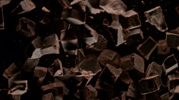 Super Slow Motion Shot of Raw Chocolate Chunks After Being Exploded Towards The Camera at 1000Fps