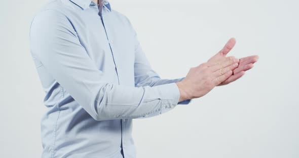 Side view of a man applauding