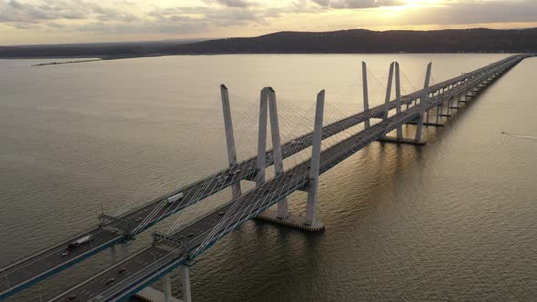 An aerial shot over the Mario M. Cuomo Bridge taken on the north side. The drone camera dolly out ov