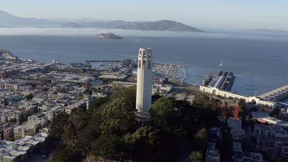Aerial, San Francisco Coit Tower and cityscape, panning right drone 01.