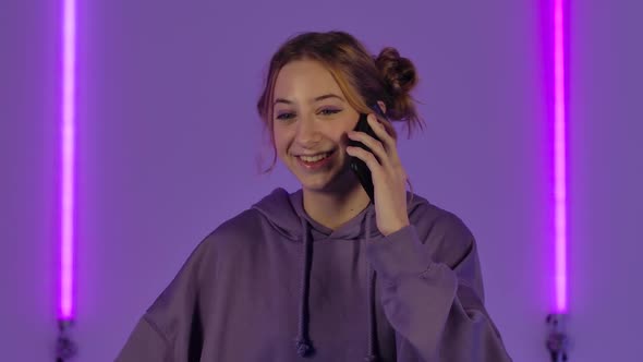 Portrait of Young Attractive Woman Talking for Mobile Phone and Rejoice