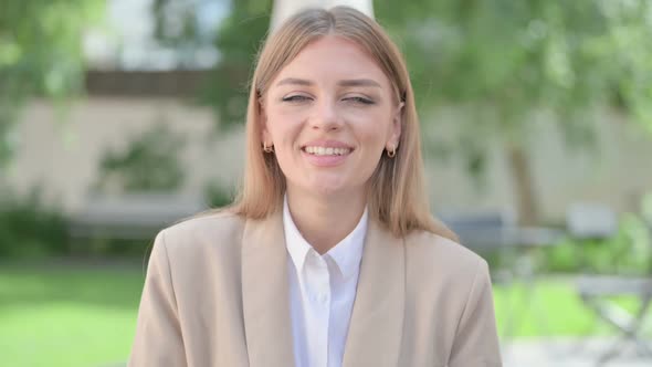 Outdoor Portrait of Young Businesswoman Talking on Online Video Call