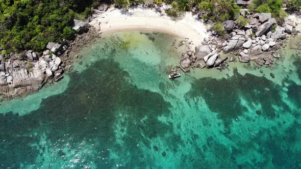 Bungalows and Green Coconut Palms on Tropical Beach. Cottages on Sandy Shore of Diving and