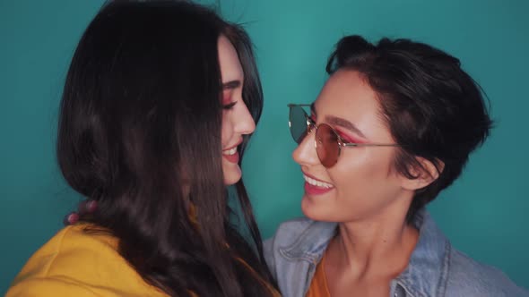 Two Happy Cool Gen z Girls Lesbian Couple Dancing Kissing at Party