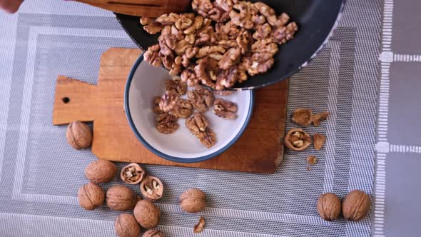 Closeup Video of Walnut Cores Poured in Ceramic Bowl