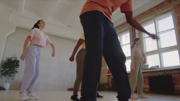 Young People Dancing with Teacher in Studio