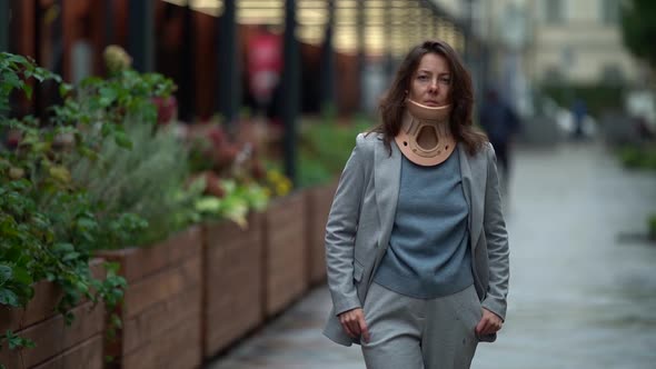 Portrait of an Adult Woman with a Medical Neck Brace To Treat a Neck Injury, Modern Lifestyle, She