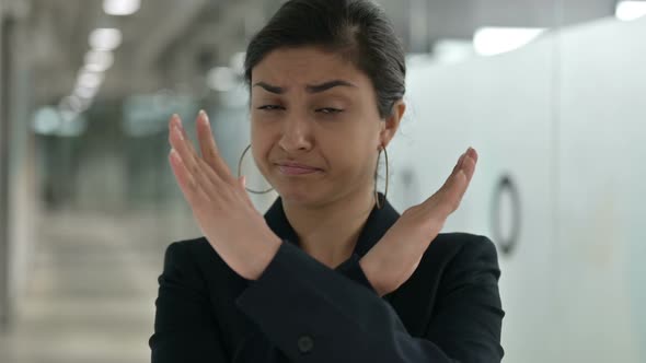 Serious Indian Businesswoman Saying No By Arms Crossed