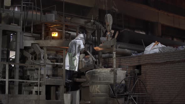 Hard Work in a Foundry. Metal Smelting Furnace in Steel Mill. Molten Metal Pouring, Metallurgy