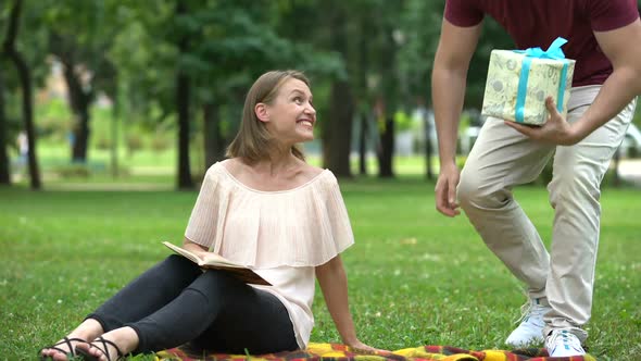 Husband Gives Present to Beloved Wife, Celebration of Birthday or Anniversary