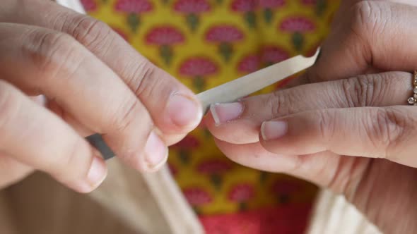 Young Women Cleaning Her Finger Nail