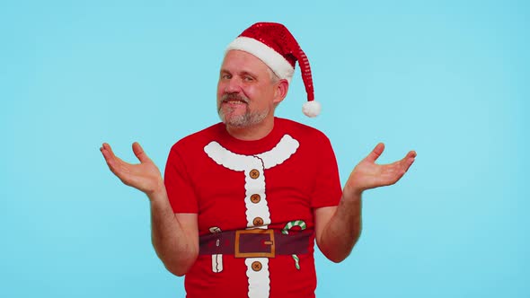 Confused Man in Christmas Tshirt Feeling Embarrassed About Ambiguous Question Having Doubts No Idea