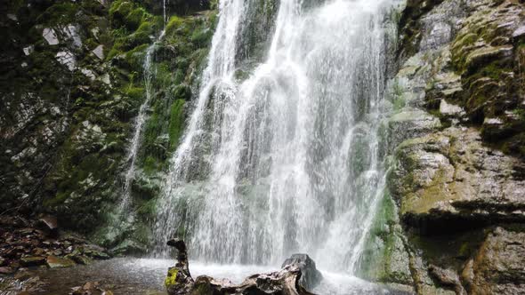 Amazing waterfall among lush greenery in fair weather