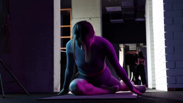 Young Woman Doing Pilates  Doing Exercises on the Yoga Mat