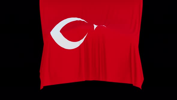 The piece of cloth falls with the flag of the State of Turkey to cover the product or item behind th