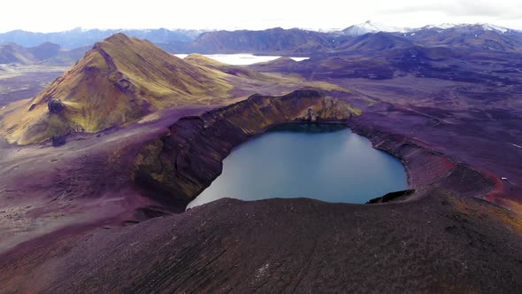 Volcanic lake behind hill slope