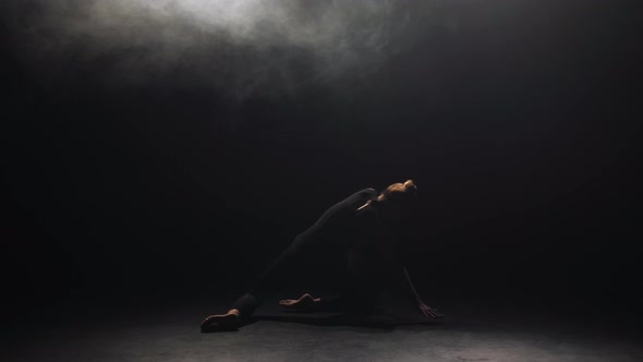 Charming Young Woman in Black Dancing at Dusk