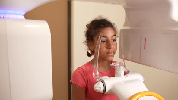 Preteen Girl Taking Dental Xray in Modern Clinic