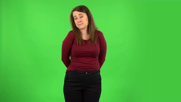 Pretty Girl Is Smiling and Shrugging. Green Screen