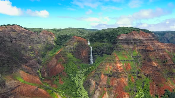 Aerial view of jurssic falls at Waimea Canyon In Kauai Island