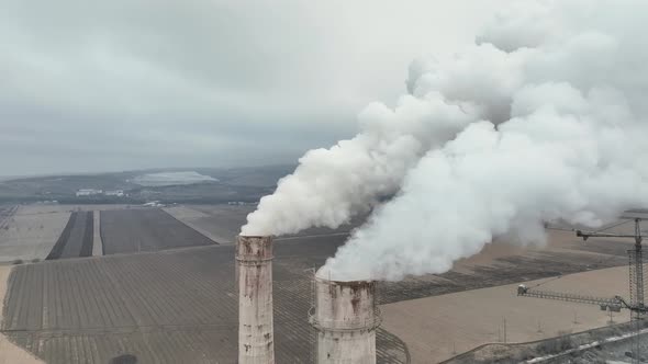 Aerial View of Oil and Gas Petrochemical Base Industry and Oil Refinery at Sunset in Cloudy Weather